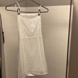 White sparkly sequin mini dress with criss cross tie back